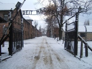 The entrance to the concentration camp Auschwitz I reads "Arbeit macht frei" -- "Work makes (one) free." (Wikimedia Commons)