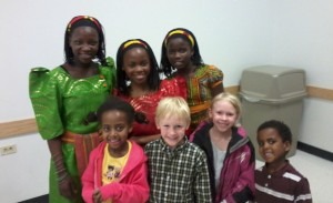 After the performance, our kids posed with three of the Watoto children in the traditional Ugandan dress. (Marrton Dormish)