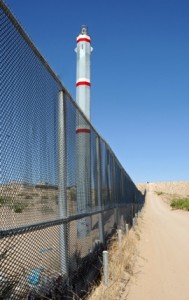 The fence that separates the United States from Mexico at Anapra, shown from the American side. (Photo by Heath Haussamen)