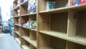 A half-full supply shelf at the Broomfield FISH food bank. (Marrton Dormish)