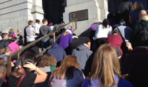 Members of Denver-area faith communities kneel on the steps of the Colorado State Capitol during a recent prayer vigil for justice, peace and an end to racism. (Marrton Dormish) 