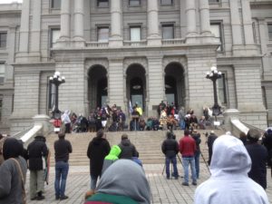 Cheyenne and Arapaho tribal leaders and memorial runners joined state representatives on the steps of the state capitol on Nov. 29 to remember the Sand Creek Massacre. (Marrton Dormish)