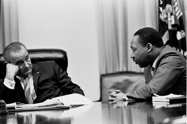 Martin Luther King, Jr., with Pres. Lyndon B. Johnson. (Yoichi R. Okamoto via Wikimedia Commons)