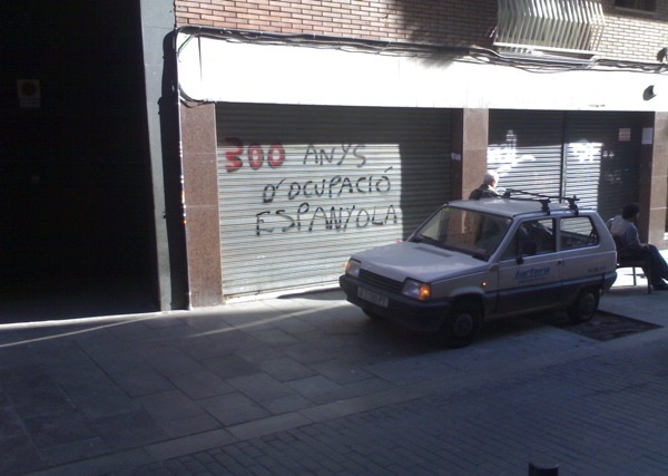 This central Barcelona garage door graffiti says in Catalan, "300 years of Spanish occupation." (Marrton Dormish)