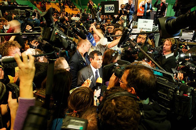 Mohamed Nasheed of the Maldives briefs reporters during the 2009 Copenhagen climate change talks. At the time, Nasheed was president of the Maldives, but he was forced to resign under threat of violence from a coup in February 2012. (Adam Wells, tcktcktck campaign, via Wikimedia Commons)