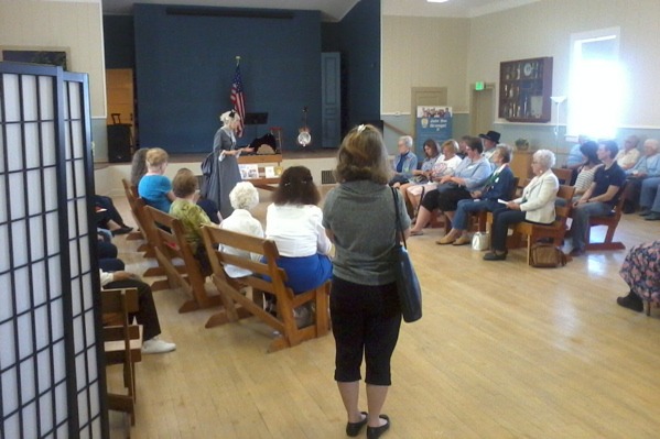 Attendees look on during a living history presentation at the Crescent Grange in Broomfield, Colo. (Marrton Dormish)
