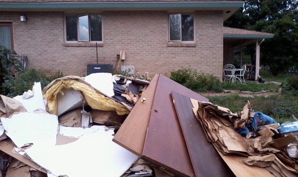 Debris piled up outside a South Boulder home. (Marrton Dormish)