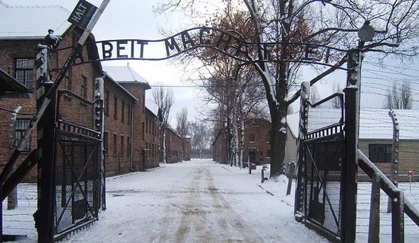 The entrance to the concentration camp Auschwitz I reads "Arbeit macht frei" -- "Work makes (one) free." (Logaritmo via Wikimedia Commons)