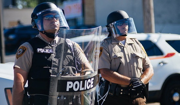 Police in riot gear at Ferguson, Mo., protests in August 2014. (Jamelle Bouie via Wikimedia Commons)